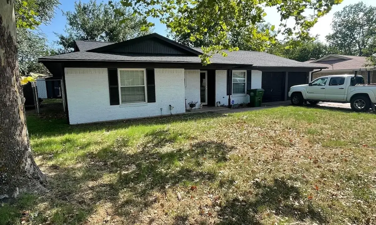 Professional roofing crew working on a residential roof in Flowery Branch